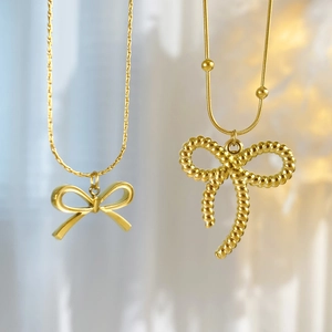 Elegant 18K gold plated titanium steel bow necklace with smooth and spiral textures
