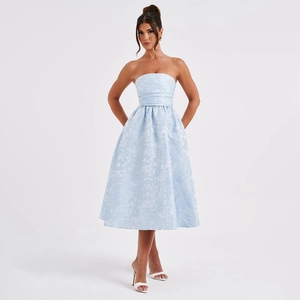 Detail of light blue strapless midi dress with textured jacquard fabric on model