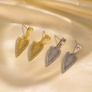 Elegant heart-shaped pearl earrings in gold and silver finish with sparkling rhinestones
