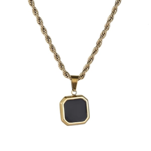 Close-up of golden rope chain and octagonal square pendant with black enamel inlay