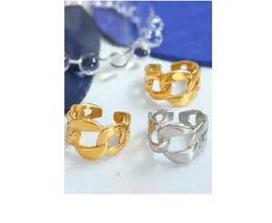 Macro shot of minimalist gold and silver thick chain rings with adjustable open band design