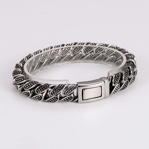 Close-up of men's punk woven texture bracelet with retro silver-black metal clasp
