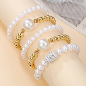 5-piece layered faux pearl bracelet set with golden beads and sparkling rhinestones
