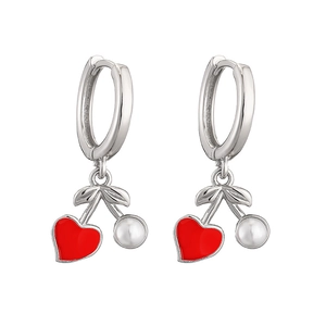 Detail of silver hoop earrings featuring a red heart and white pearl cherry pendant