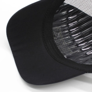 Detail of reinforced stitching on brim and breathable mesh of the camouflage baseball cap