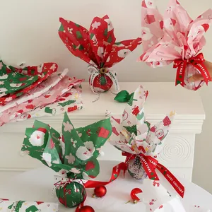 Christmas bouquet gift wrapping paper set with Santa patterns and festive ribbons