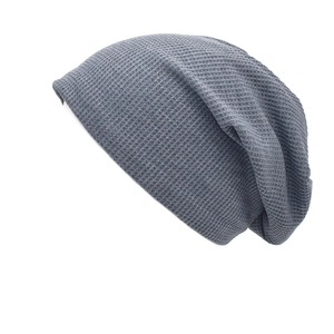 Grey waffle knit slouchy beanie hat for women featuring a minimalist breathable design