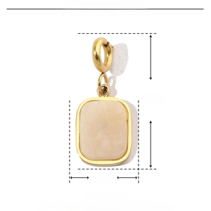 Detail of 18k gold heart pendant with natural stone inlay and size measurements