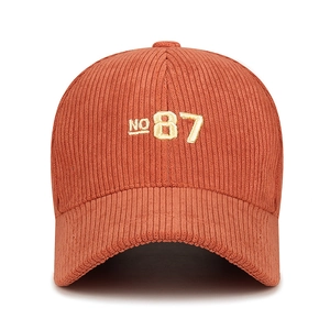 Orange corduroy baseball cap with NO 87 embroidery and vintage curved brim style