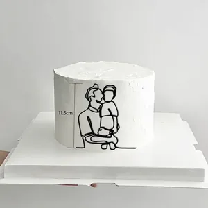 Detail showing 11.5cm minimalist acrylic cake topper with father and son line art
