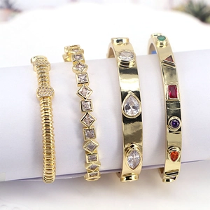 Detail view of gold-plated bracelets set with sparkling cubic zirconia on display