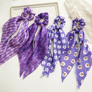 Silk-like periwinkle purple ribbon hair scrunchies with various elegant floral patterns