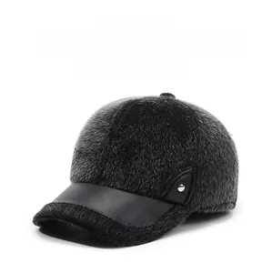 Detail of gray plush winter baseball cap for men with a black faux leather brim and button