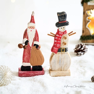 Festive wooden Christmas tree tabletop ornaments with Santa and Snowman on white snow