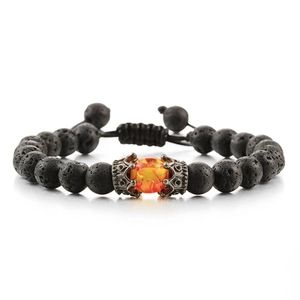 Detail of volcanic rock bead bracelet with silver crown setting and orange centerpiece