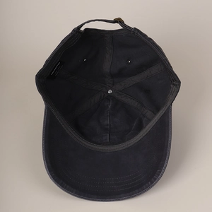 Interior view of navy blue 100% cotton baseball cap showing lining and care label details