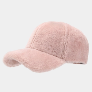 Close-up of pink plush texture and detailed stitching on a warm fleece baseball cap