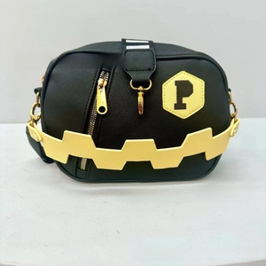 Minimalist black crossbody bag with yellow letter P patch and zigzag strap detail