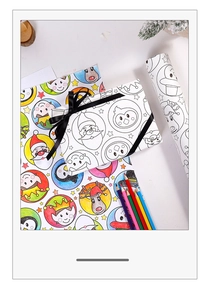 Detail of DIY Christmas kraft wrapping paper with coloring patterns and black ribbons