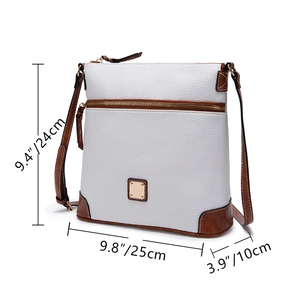 Detail view of pebbled leather crossbody bag showing size dimensions in centimeters and inches