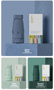 Detail of ultra-light six-fold mini pocket umbrellas in various Morandi green and blue colors