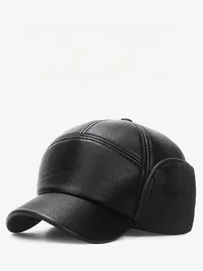 Close-up of black PU leather winter hat with warm fleece lining and ear flaps