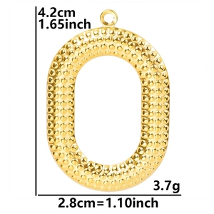 Detailed view of gold oval pendant with dimensions 4.2x2.8cm and hammered metal texture