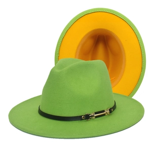 Detail of green fedora hat showing yellow lining, black leather band, and gold buckle