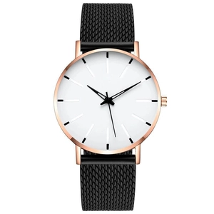 Detail of minimalist white dial and rose gold hands on a black mesh strap watch