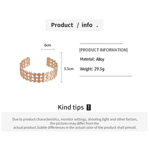 Detail of rose gold alloy cuff bracelet showing weight 29.5g and woven grid structure