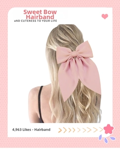 Rear view of a pink satin bow hair clip accessory worn on elegant wavy long hair