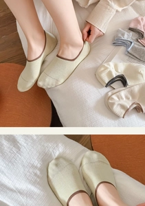 Detail of candy-colored low-cut cotton socks showing breathable fabric and anti-slip design