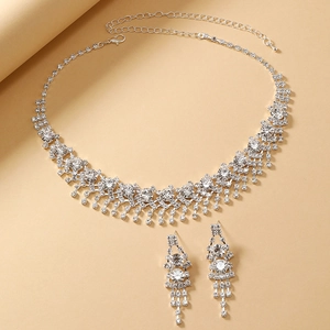 Elegant silver bridal jewelry set with white crystal rhinestone necklace and tassel earrings