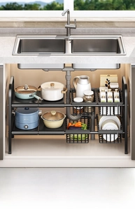 Detail of adjustable under-sink rack showing double-tier metal shelves and drainage basket
