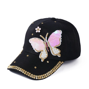 Black baseball cap with pink sequin butterfly and golden rhinestone brim decoration