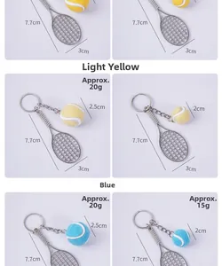 Detailed view of mini tennis racket keychain showing size dimensions and yellow plush ball