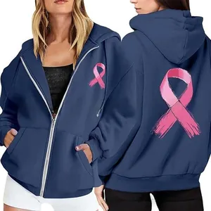 Front and back detail of a dark blue zip-up hoodie featuring pink ribbon breast cancer prints