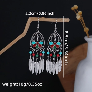 Detail view of Bohemian tassel earrings with dimensions 8.5cm by 2.2cm on dark background