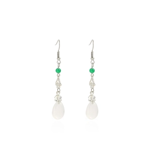 Macro detail of Chinese style drop earrings with white teardrop pearls and jade beads