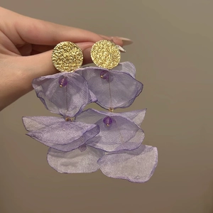 Detail showing elegant purple chiffon flower petals and beads on gold stud earrings