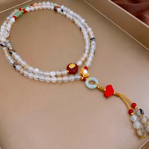 Elegant floral pearl and agate multi-layer necklace with jade ring pendant and tassel charm