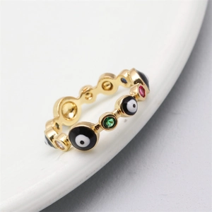 Macro shot of 18K gold plated evil eye ring with colorful enamel and zircon stones