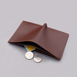 Slim brown leather vertical wallet for men with textured finish and card slots
