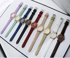 Collection of ten stylish women's quartz watches in various colors with faux leather straps