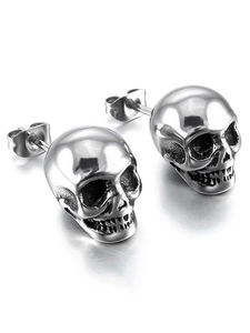 Detailed view of punk style skull stud earrings in polished silver zinc alloy for unisex