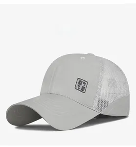 Detail view of breathable mesh panel and embroidery on a gray summer baseball cap