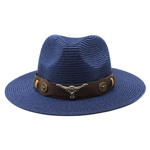 Vintage navy blue woven straw cowboy hat with leather band and metal bull head emblem