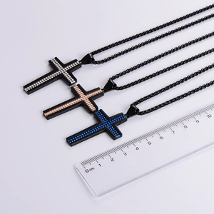 Three stainless steel cross necklaces in black, gold, and blue with matching chains