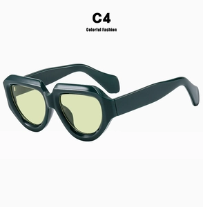 Retro irregular thick frame sunglasses in dark green finish with pale yellow lenses.