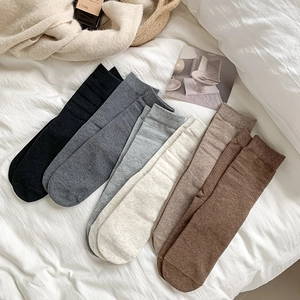 Set of women's autumn crew socks in various earth tones with fine vertical ribbing